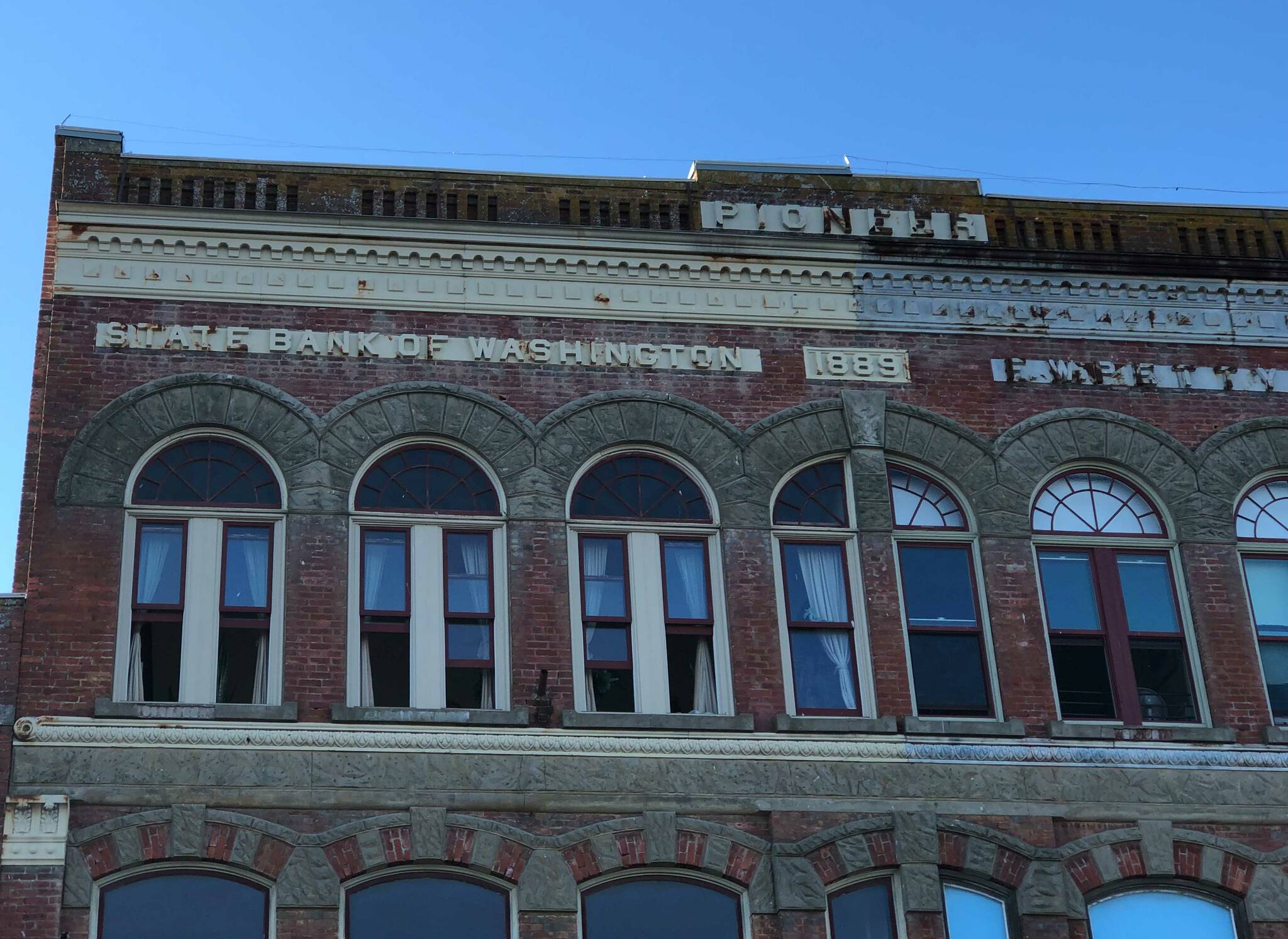The idea of a state bank is not new. This 1889 Port Townsend building has “State Bank of Washington” engraved on its front. (Photo by Morf Morford)