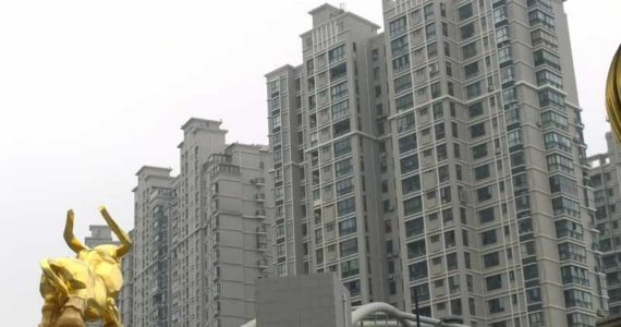 This is a typical Shanghai neighborhood. Be sure to notice the golden bull in the foreground. (Photo by Morf Morford)