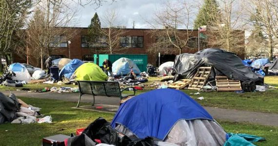 How many of the residents of this homeless camp will be moving into the new units on Proctor or at Point Ruston? (Photo by Morf Morford)