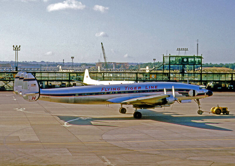 This is a Lockheed L-1049H Super Constellation N6918C of Flying Tiger Line at London Gatwick in 1964; Image Credit: By RuthAS - Own work, CC BY 3.0, https://commons.wikimedia.org/w/index.php?curid=37915164.