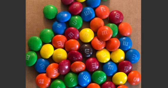 Apparently the ever-diligent Tucker Carlson was right. If you look closely, you can see that some Ws (for Woke) have been mixed-in with the Ms on these once familiar all-American candies. Some even look like the letter E - and you know what that stands for. (Photo by Morf Morford)
