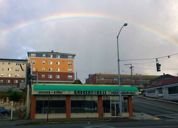 As the song from The Wizard of Oz puts it, there’s refuge “somewhere over the rainbow”. We in Tacoma, for better or worse, live our lives under the rainbow. (Photo by Morf Morford)
