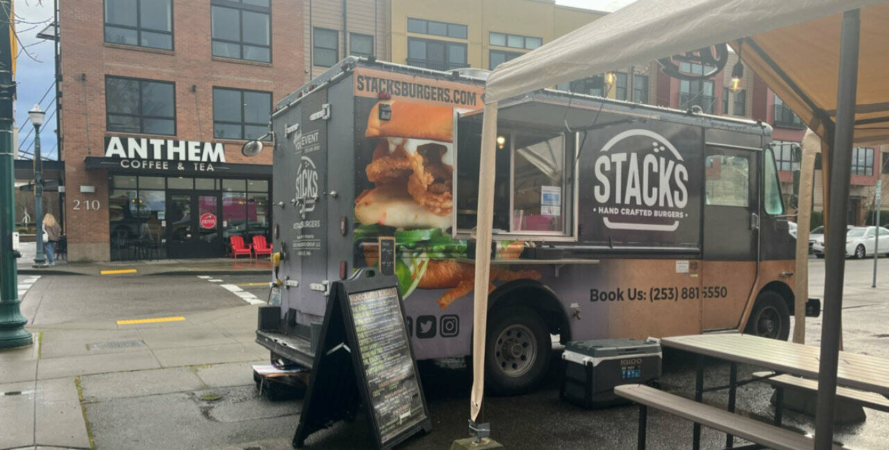 The picture with the truck with the Anthem Coffee in the background is the Puyallup location and Donna took that picture.