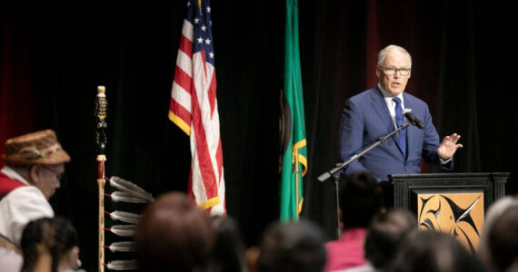 Gov. Jay Inslee addresses a packed room before signing a number of bills into law on Tuesday, March 19, 2024, at Tulalip Casino’s Orca Ballroom in Tulalip, Washington. (Ryan Berry / The Herald)