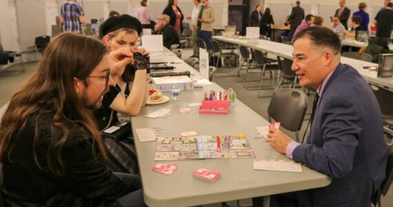 Washington Secretary of State Steve Hobbs, right, seen here at a game night event in February 2024, at the state Capitol in Olympia, will travel to Japan on a trip to promote economic ties between the country and Washington state, including in the tabletop gaming sector. (Secretary of State’s Office)