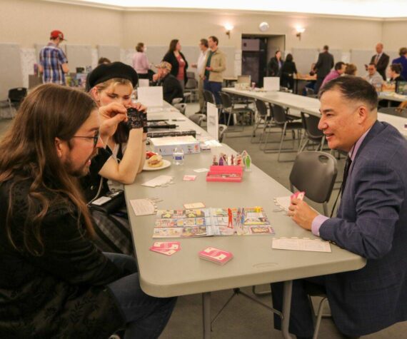 Washington Secretary of State Steve Hobbs, right, seen here at a game night event in February 2024, at the state Capitol in Olympia, will travel to Japan on a trip to promote economic ties between the country and Washington state, including in the tabletop gaming sector. (Secretary of State’s Office)