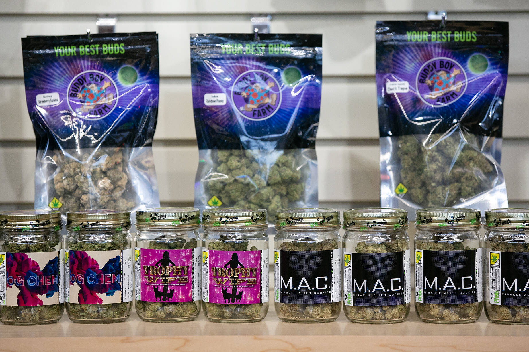 Marijuana products sit behind the counter during 210 Cannabis Co’s grand opening in 2022 in Arlington, Washington. (Sound Publishing file photo)