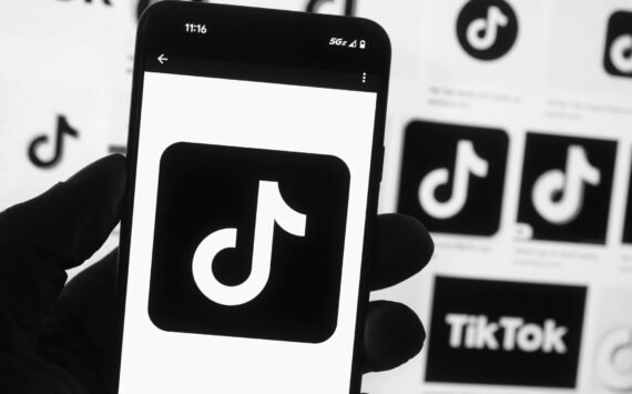 AP file photo
TikTok logo is displayed on a mobile phone in front of a computer screen.