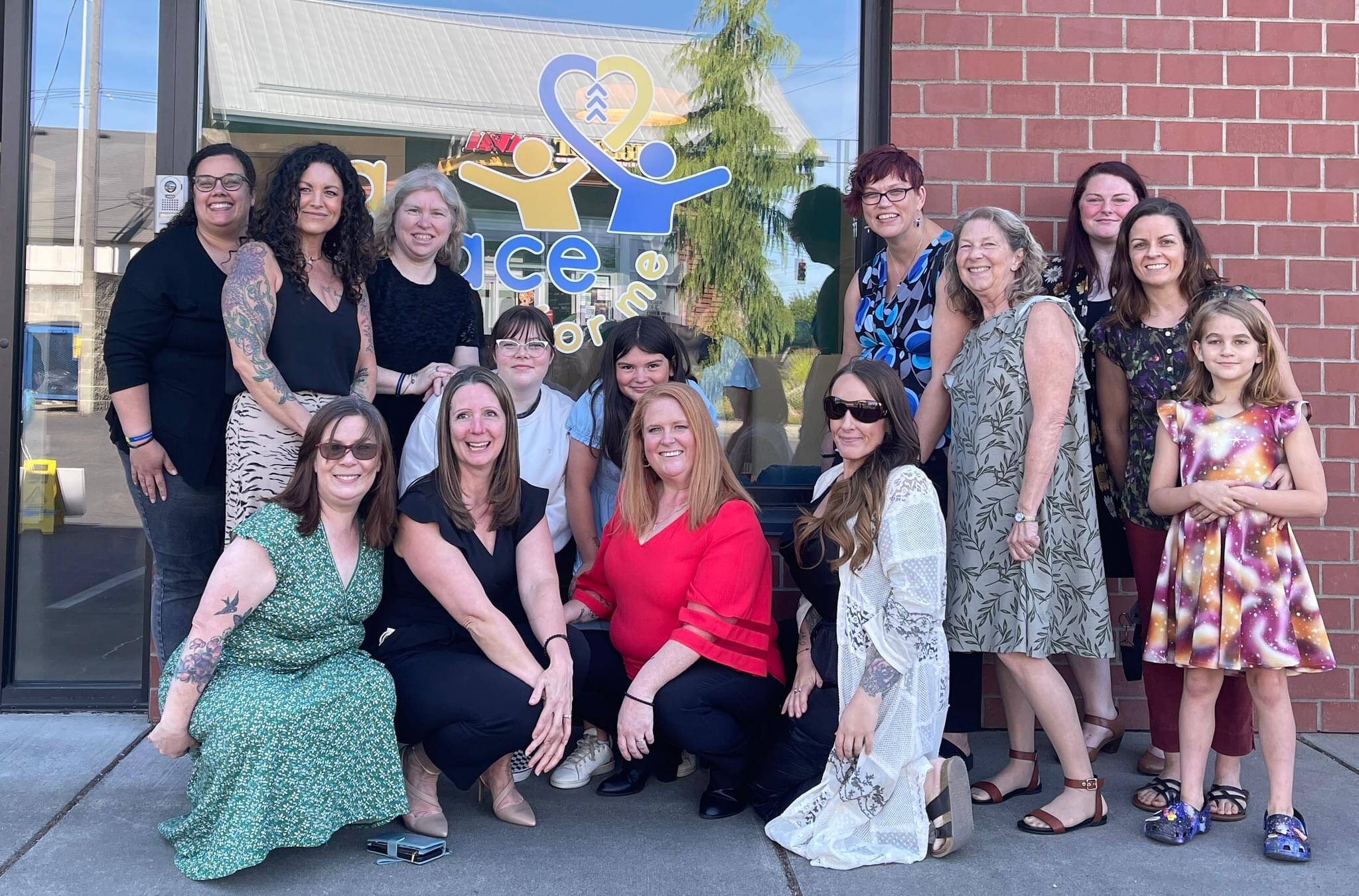 Photo courtesy of Alisha Vilela 
Alisha Vilela, center, outside A Place for Me in Tacoma.