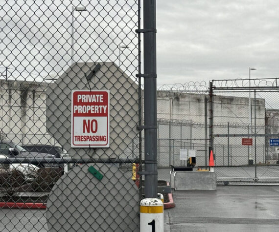 A “no trespassing” sign outside of the Northwest ICE Processing Center in Tacoma. (Grace Deng/Washington State Standard)