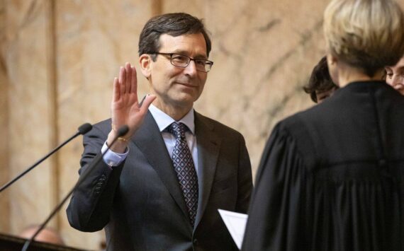 Bob Ferguson is sworn in as the 24th Governor of the State of Washington during his inauguration ceremony Wednesday, Jan. 15, 2025, at the Washington State Capitol in Olympia, Wash. (Ryan Berry/Washington State Standard)