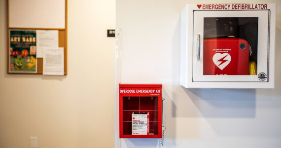 An emergency overdose kit with naloxone located next to an emergency defibrillator at Mountain View student housing at Everett Community College. (Sound Publishing File photo)