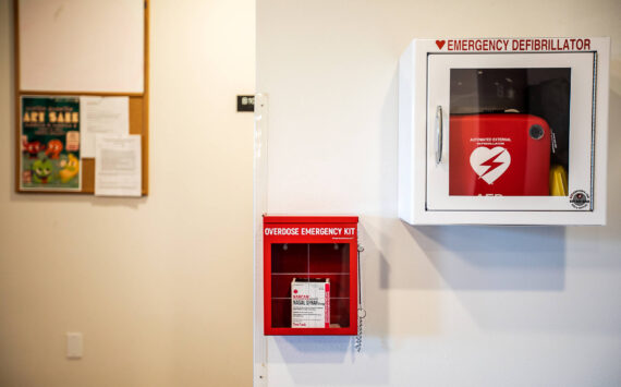 An emergency overdose kit with naloxone located next to an emergency defibrillator at Mountain View student housing at Everett Community College. (Sound Publishing File photo)