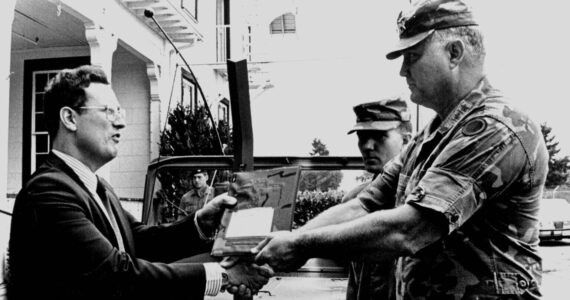 Norman Schwarzkopf, then a lieutenant general, transfers his command jeep to Alan Archambault, director of the Lewis Army Museum, in 1987. (Photo courtesy of Alan Archambault)