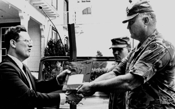 Norman Schwarzkopf, then a lieutenant general, transfers his command jeep to Alan Archambault, director of the Lewis Army Museum, in 1987. (Photo courtesy of Alan Archambault)
