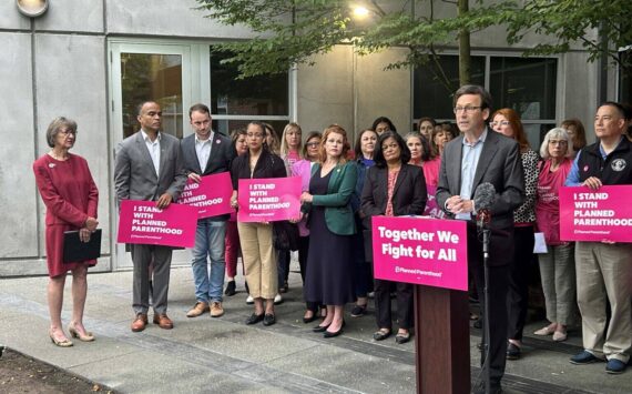 Photo by Jake Goldstein-Street/Washington State Standard 
Washington Gov. Bob Ferguson speaks to reporters about federal cuts to Medicaid funding outside a Planned Parenthood clinic alongside advocates, state lawmakers and statewide elected officials on Wednesday, July 9, 2025, in Seattle.
