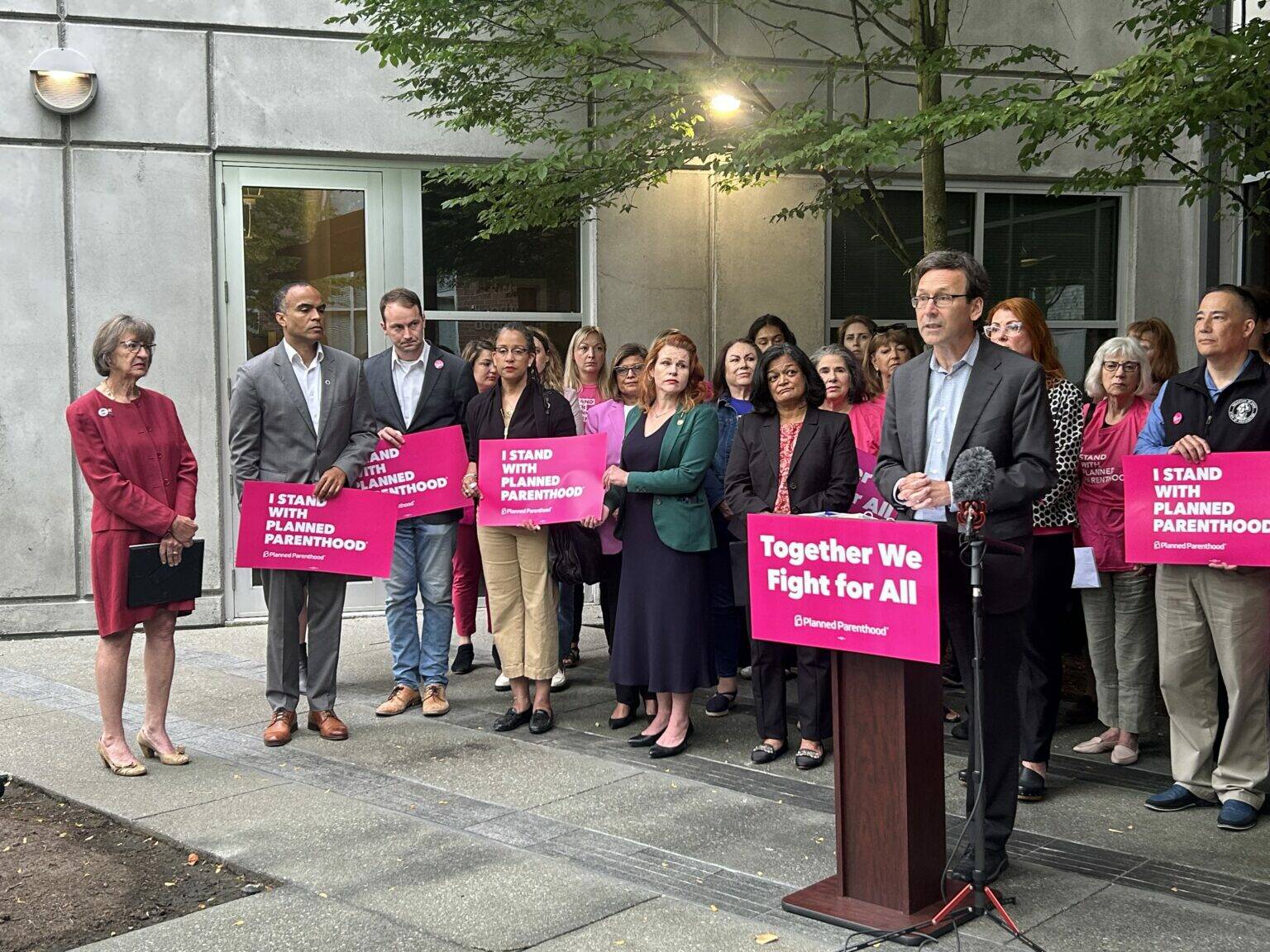 Photo by Jake Goldstein-Street/Washington State Standard 
Washington Gov. Bob Ferguson speaks to reporters about federal cuts to Medicaid funding outside a Planned Parenthood clinic alongside advocates, state lawmakers and statewide elected officials on Wednesday, July 9, 2025, in Seattle.