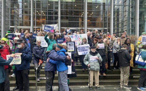 Opponents of President Donald Trump’s executive order indefinitely halting refugee resettlement in the U.S. rally on the steps of the federal courthouse in Seattle on Feb. 25, 2025, after a judge issued a ruling blocking the president’s order. (Photo by Jake Goldstein-Street/Washington State Standard)