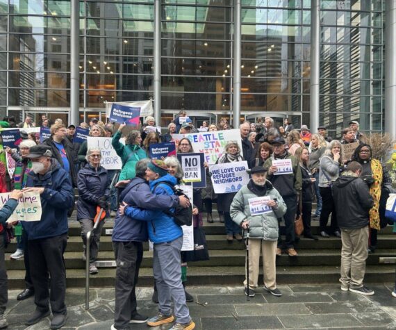 Opponents of President Donald Trump’s executive order indefinitely halting refugee resettlement in the U.S. rally on the steps of the federal courthouse in Seattle on Feb. 25, 2025, after a judge issued a ruling blocking the president’s order. (Photo by Jake Goldstein-Street/Washington State Standard)