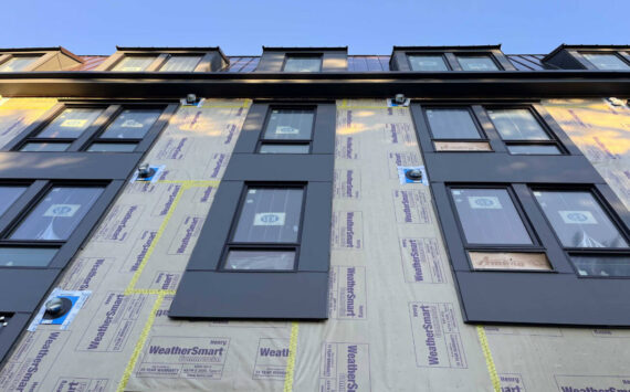 An apartment building under construction in Olympia, Washington in January 2025. Critics of a proposal to cap rent increases in Washington argue that it could stifle new development. (Photo by Bill Lucia/Washington State Standard)