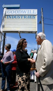 Christine Zemanek, executive director the Gary E. Milgard Family Foundation, and local developer Hugh S. Ferguson discuss Tacoma Goodwill's new job center during Wednesday's groundbreaking ceremony. (PHOTO BY TODD MATTHEWS)