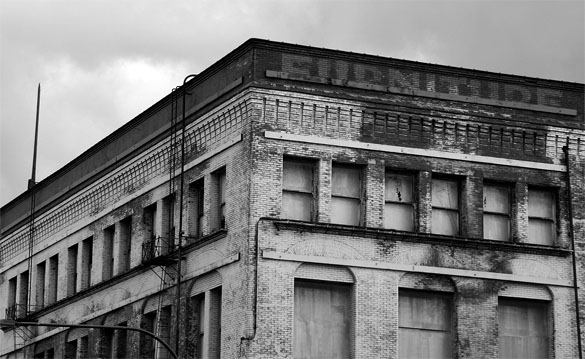 Abandoned for more than two decades, the six-story Luzon Building has seen better days. Downtown Tacoma-based Gintz Group hopes the building's natural light and large floor plans will appeal to tenants once a $7.5 million renovation is complete. (PHOTO BY TODD MATTHEWS)
