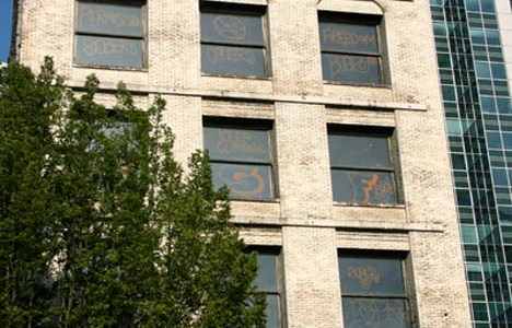 Taggers hit the 119-year-old Luzon Building in downtown Tacoma this week. (PHOTO BY TODD MATTHEWS)