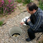 BLRB Architects Associate Ben Ferguson shows off part of Pacific Plaza's innovative green roof irrigation system. (PHOTO BY TODD MATTHEWS)