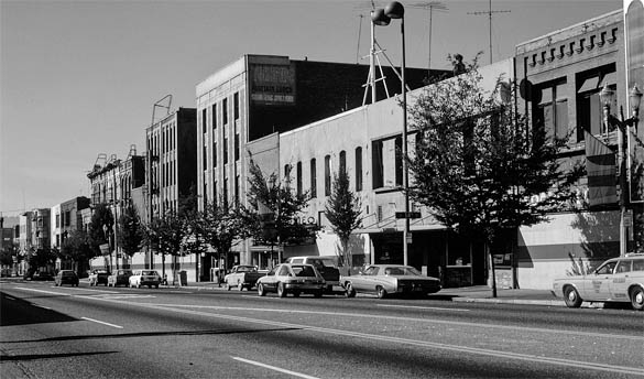 A historic photograph of the buildings that lined Pacific Avenue near the Luzon Building in downtown Tacoma. (COLUMBIA CORNERSTONE DEVELOPMENT COMPANY PHOTO COLLECTION 2008-7, COURTESY OF WEYERHAEUSER ARCHIVES)