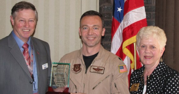 George Cargill of TriWest Healthcare Alliance (left) and Kiwanis Club President Sandy Roszman (right) presented the 2011 Howard O. Scott Citizen-Soldier of the Year Award to U.S. Air Force Reservist Lt. Col. Diego Wendt. (PHOTO COURTESY TACOMA-PIERCE COUNTY CHAMBER)