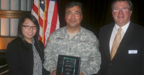 Sergeant First Class Luis Jimenez was awarded the John H. Anderson Military Citizen of the Year Award on Thursday. He was joined by his wife Sin Young Jimenez and Tri West Healthcare Alliance service director Rick Becker. (PHOTO COURTESY TACOMA-PIERCE COUNTY CHAMBER)