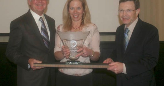 Tom Taylor (left) and Steve Thomason (right) of Taylor-Thomason Insurance Brokers present the Tacoma-Pierce County Chamber's Tahoma Environmental Award to Elaine Ott (center) of Richlite Company. (PHOTO COURTESY TACOMA-PIERCE COUNTY CHAMBER)
