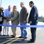 Representatives from the City of Tacoma and the Port of Tacoma celebrated the official re-opening of the Hylebos Bridge during a ribbon-cutting ceremony Wednesday. The bridge was out of commission for more than a decade before funding from the City of Tacoma, the Federal Highway Administration, and the Port of Tacoma paid for repairs. The Hylebos Bridge, which spans the Hylebos Waterway on East 11th Street, is an important transportation corridor for truck drivers hauling cargo throughout the tide flats and Northeast Tacoma residents headed toward State Route 509. (PHOTO BY TODD MATTHEWS)