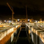 The gate of the casting basin was removed early Monday morning at the Concrete Tech Corporation site in Tacoma. Once the gate was pulled, high tide filled the basin, allowing crews to move in with tug boats to tow them out into the open water. (PHOTO COURTESY WASHINGTON STATE DEPARTMENT OF TRANSPORTATION)