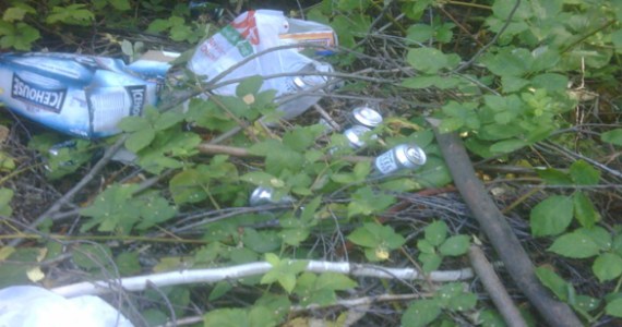 Fortified beer cans littered a transient camp near South 12th Street and State Route 16 in Tacoma's West End neighborhood last August, according to City of Tacoma officials. (PHOTO COURTESY CITY OF TACOMA)
