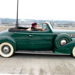 Tacoma Mayor Marilyn Strickland crosses the Murray Morgan Bridge Friday morning in a classic automobile. (PHOTO COURTESY CITY OF TACOMA)