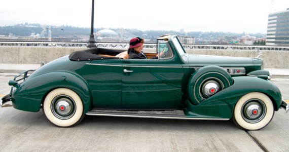 Tacoma Mayor Marilyn Strickland crosses the Murray Morgan Bridge Friday morning in a classic automobile. (PHOTO COURTESY CITY OF TACOMA)