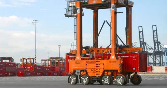 A straddle carrier moves a "K" Line cargo container at the Port of Tacoma's Husky Terminal. (PHOTO COURTESY PORT OF TACOMA)