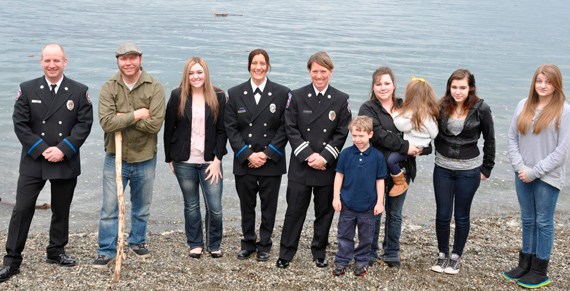 (from left to right) Tacoma fire fighter Jack Hawkins, John Bronson, Rebecca Thayer-Blunt, fire fighter Annie Craig, captain Jennifer Gunnel, and extended family at Owen Beach. (PHOTO COURTESY TACOMA FIRE DEPARTMENT)