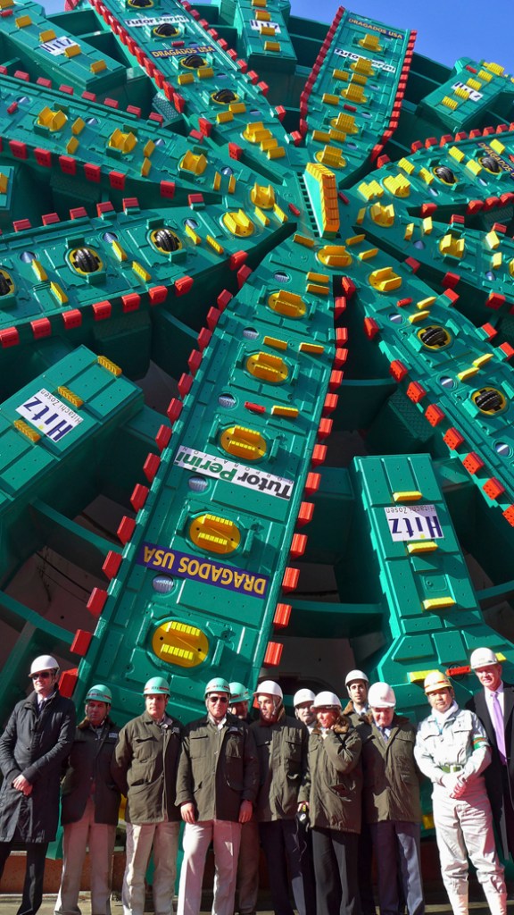 SR 99 Tunnel Project leaders pose in front of Bertha in December 2012. Manufactured in Japan, the five-story-tall machine will begin tunneling beneath Seattle in summer 2013 to replace the waterfront section of the Alaskan Way Viaduct. The tunnel is scheduled to open in late 2015. (PHOTO COURTESY WASHINGTON STATE DEPARTMENT OF TRANSPORTATION)