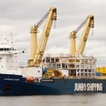 Bertha, the world's largest tunneling machine, arrives in Seattle's Elliott Bay on April 2, 2013, following a 5,000-mile journey from Osaka, Japan. Crews will unload her 41 pieces (the largest weighing about 900 tons) and move them to the 80-foot-deep pit to the west of Seattle's stadiums, where Bertha will begin tunneling in summer 2013. (PHOTO COURTESY WASHINGTON STATE DEPARTMENT OF TRANSPORTATION)