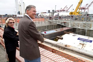 Gov. Jay Inslee and former Gov. Chris Gregoire prepare for a bottle-breaking ceremony Saturday in downtown Seattle to mark the State Route 99 tunneling machine's (nicknamed "Bertha") approaching departure beneath the city. The event drew more than 5,000 people. (PHOTO COURTESY WSDOT)