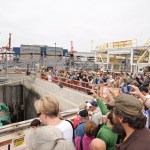 Guests at a public dedication ceremony Saturday try to get a glimpse of the machine as its five-story-tall cutterhead spins. (PHOTO COURTESY WSDOT)