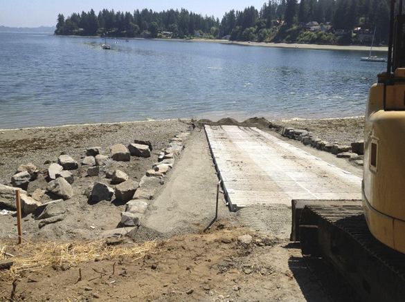 Pierce County Public Works crews are nearly finished rehabilitating the A Street KPS boat launch in the community of Home near Carr Inlet. The boat launch was closed on July 15 to allow crews to replace the existing ramp structure with concrete panels purchased from the Washington Department of Fish and Wildlife. According to Pierce County officials, work should be completed this week, with the exception of some paving. (PHOTO COURTESY PIERCE COUNTY)