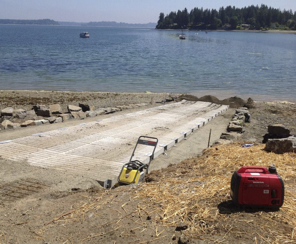 Pierce County Public Works crews are nearly finished rehabilitating the A Street KPS boat launch in the community of Home near Carr Inlet. The boat launch was closed on July 15 to allow crews to replace the existing ramp structure with concrete panels purchased from the Washington Department of Fish and Wildlife. According to Pierce County officials, work should be completed this week, with the exception of some paving. (PHOTO COURTESY PIERCE COUNTY)