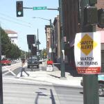 JULY 2003 | A sign at the corner of South Commerce Street and South 9th Street alerts pedestrians, bicyclists and drivers to watch for passing Tacoma Link light rail trains, as testing of Tacoma's newest transportation system began. It was just one part of Sound Transit's comprehensive safety campaign. Regular passenger service begins next month. (TACOMA DAILY INDEX FILE PHOTO)