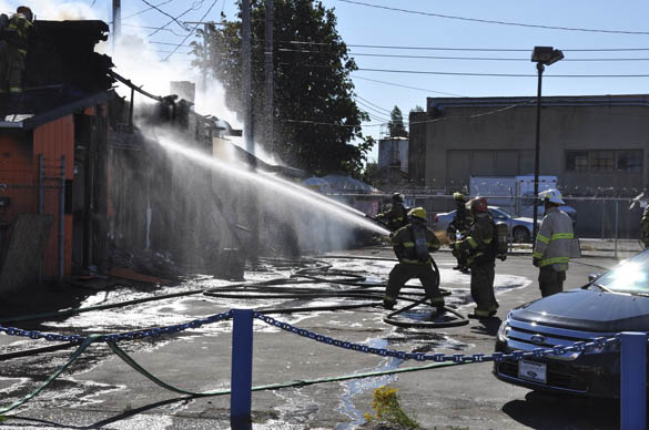 Tacoma fire fighters battle a blaze at a tavern on South Tacoma Way on Aug. 20. (PHOTO COURTESY TACOMA FIRE DEPARTMENT)