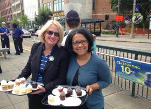 Pierce County Executive Pat McCarthy (left) and Tacoma Mayor Marilyn Strickland (right) greeted Link light rail riders at Union Station Thursday with free treats from Hello, Cupcake in downtown Tacoma.