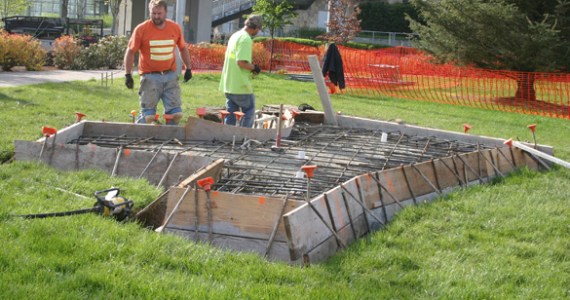 Contractors made final site preparations before concrete was poured Monday morning at the future home of Tacoma's Sun King sculpture. (PHOTO BY TODD MATTHEWS)