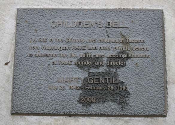 The City of Tacoma recently completed a project to restore the Children's Bell sculpture located along Ruston Way near the shores of Commencement Bay. The four-foot-tall bronze artwork was created in 2000 by artist Larry Anderson in order to celebrate the life, spirit, and accomplishments of Washington PAVE Founder and Director Marty Gentili, who passed away in 1993. The bell is decorated with images of children around the border and is meant to be rung by visitors. In April, area visitors noticed safety barricades were in place around the sculpture while the contractor spent several weeks completing restoration work on the Children's Bell sculpture. (PHOTO BY TODD MATTHEWS)
